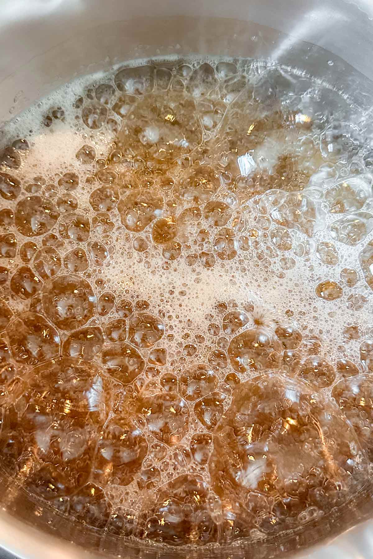 sugar syrup simmering in a pot.