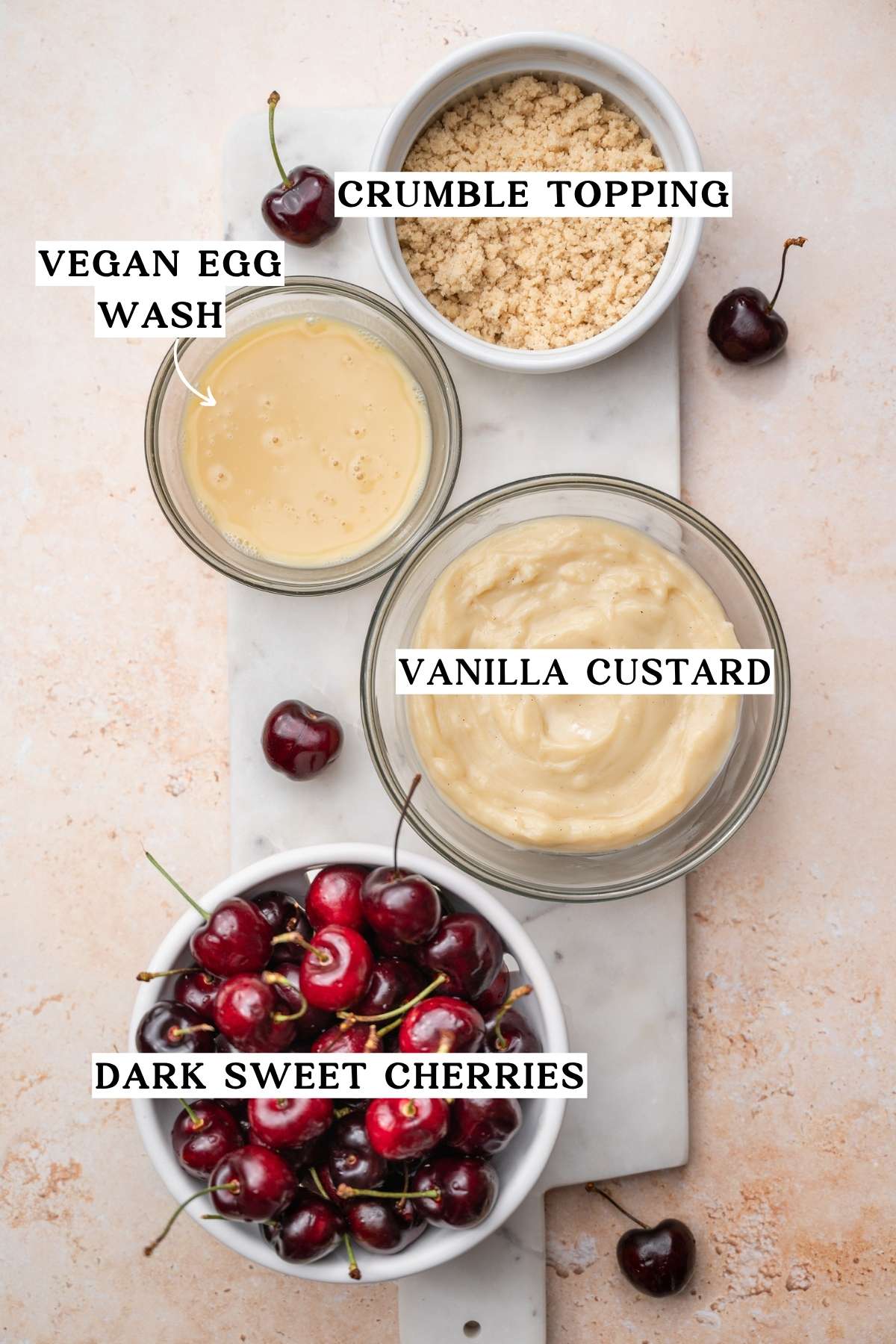 components like crumb topping, cherries, vegan egg wash and eggless custard.