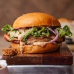 vegan chicken caesar sandwich on a cutting board.