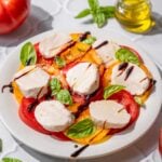 vegan caprese salad on a plate with balsamic drizzle.