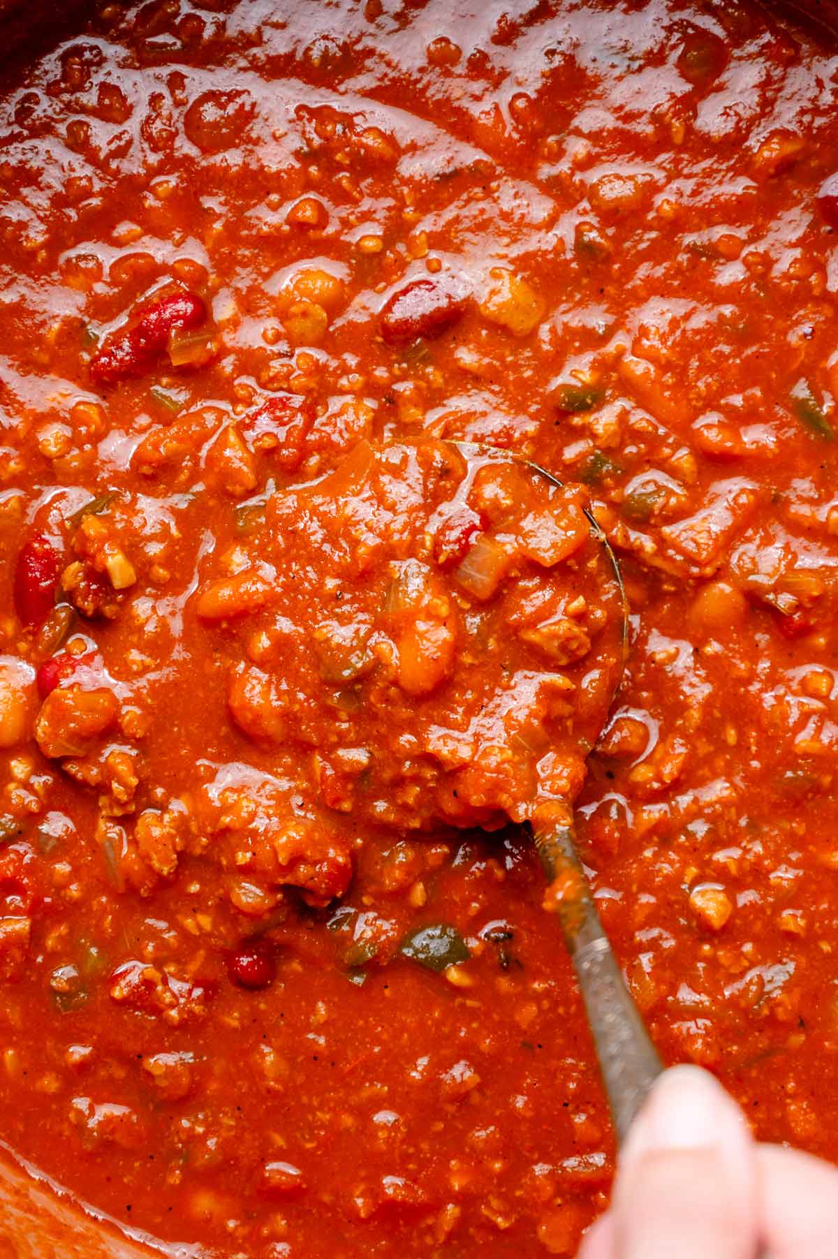 the vegan chili simmering with TVP, beans and broth until silky and thick.