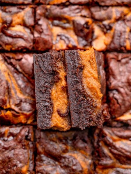 two vegan pumpkin brownies with a fudgy texture.