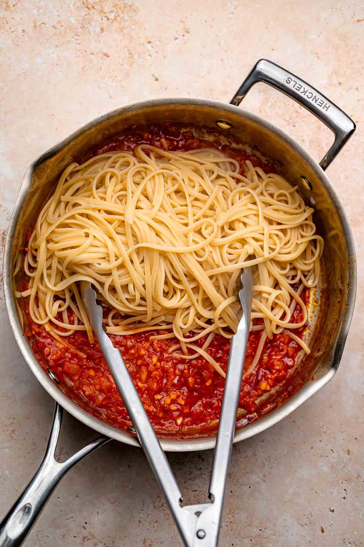 cooked linguine on the chili flake and lemon pasta sauce.