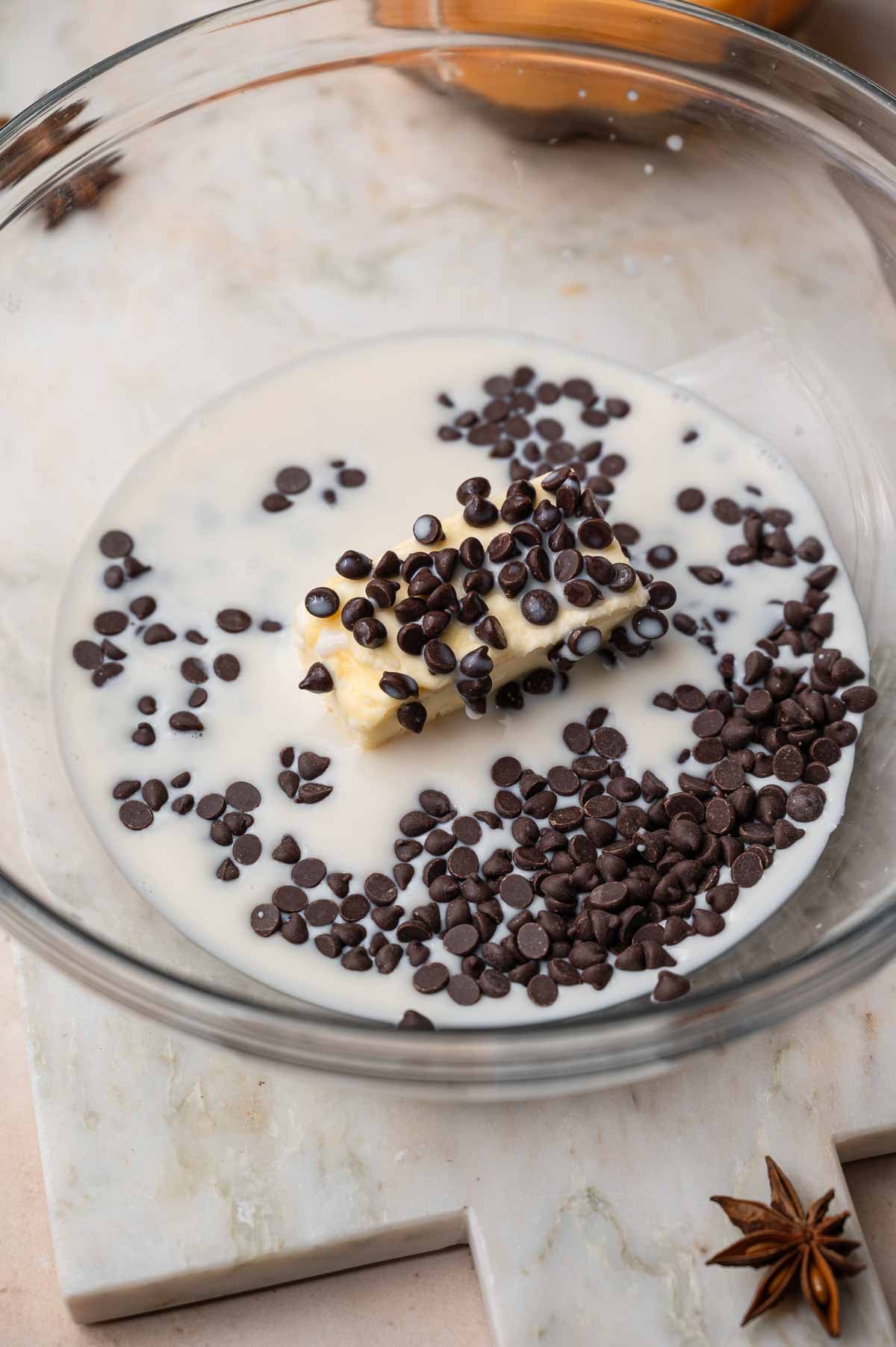 soy milk, vegan butter and chocolate chips in a large glass mixing bowl.